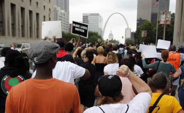 Protesters march to the Thomas F. Eagleton Federal Courthouse on Aug. 10, 2015, in St. Louis. Protesters march to the Thomas F. Eagleton Federal Courthouse on Aug. 10, 2015, in St. Louis.