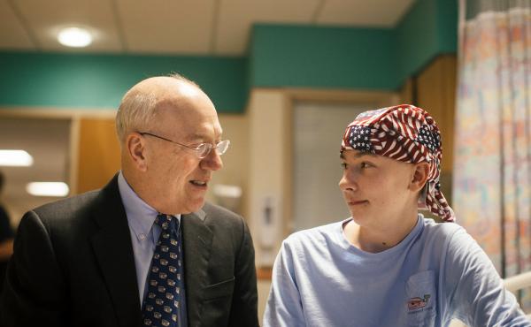 Dr. Kurt Newman visits with 14-year-old Jack Pessaud, who's undergoing treatment for a cancerous tumor in his knee at Children's National Health System in Washington, D.C. Dr. Kurt Newman visits with 14-year-old Jack Pessaud, who's undergoing treatment for a cancerous tumor in his knee at Children's National Health System in Washington, D.C.