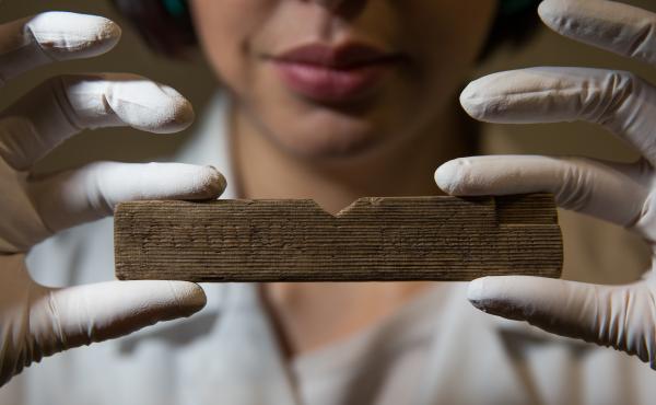 Archaeological conservator Luisa Duarte holds a Roman waxed writing tablet at Bloomberg's London offices on Wednesday. This tablet contains the earliest written reference to London, dated A.D. 65-80; it reads "Londinio Mogontio" -- that is, "in London Archaeological conservator Luisa Duarte holds a Roman waxed writing tablet at Bloomberg's London offices on Wednesday. This tablet contains the earliest written reference to London, dated A.D. 65-80; it reads "Londinio Mogontio" -- that is, "in London
