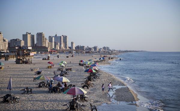 Families and friends enjoy their time on a Gaza City beach. Israel allows in international aid workers, journalists and diplomats, but tourists are prohibited. Families and friends enjoy their time on a Gaza City beach. Israel allows in international aid workers, journalists and diplomats, but tourists are prohibited.
