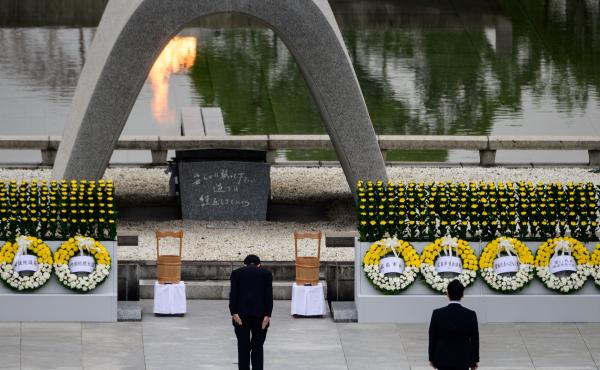 Japanese Prime Minister Shinzo Abe bows Thursday in front of a memorial to people who were killed in the 1945 atomic bombing of Hiroshima. Japanese Prime Minister Shinzo Abe bows Thursday in front of a memorial to people who were killed in the 1945 atomic bombing of Hiroshima.
