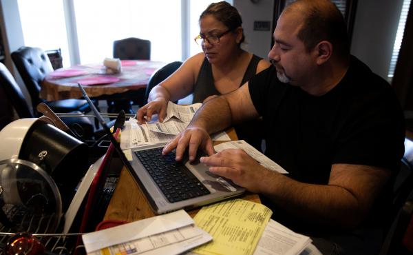 Claudia and Jesús Fierro of Yuma, Ariz., review their medical bills. They pay $1,000 a month for health insurance yet still owed more than $7,000 after two episodes of care at the local hospital. Claudia and Jesús Fierro of Yuma, Ariz., review their medical bills. They pay $1,000 a month for health insurance yet still owed more than $7,000 after two episodes of care at the local hospital.