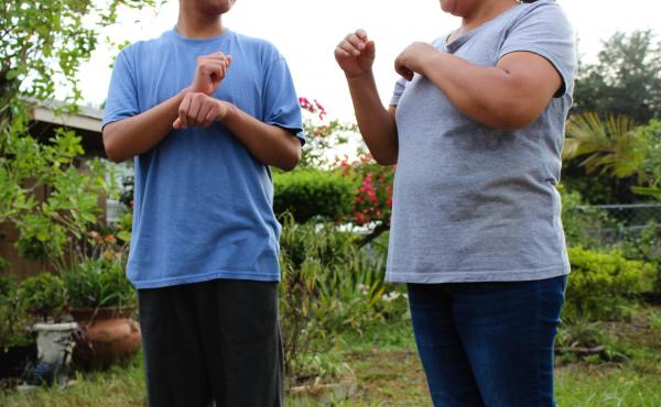 A Guatemalan teen asylum-seeker (left), who isn't able to hear or speak, signs with his mom in Florida. He was brusquely separated from her and held in a shelter for nearly three months, unable to readily communicate, according to a civil rights complaint A Guatemalan teen asylum-seeker (left), who isn't able to hear or speak, signs with his mom in Florida. He was brusquely separated from her and held in a shelter for nearly three months, unable to readily communicate, according to a civil rights complaint