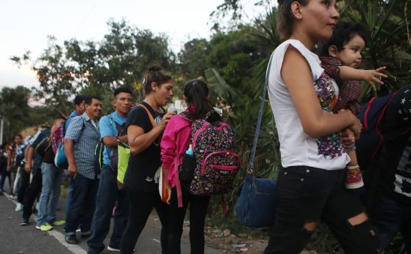 Honduran migrants wait in line to cross over the border checkpoint into Guatemala in Agua Caliente, Honduras. A new caravan of at least several hundred Hondurans has set off toward the United States on foot or in vehicles. Some have already crossed into G Honduran migrants wait in line to cross over the border checkpoint into Guatemala in Agua Caliente, Honduras. A new caravan of at least several hundred Hondurans has set off toward the United States on foot or in vehicles. Some have already crossed into G