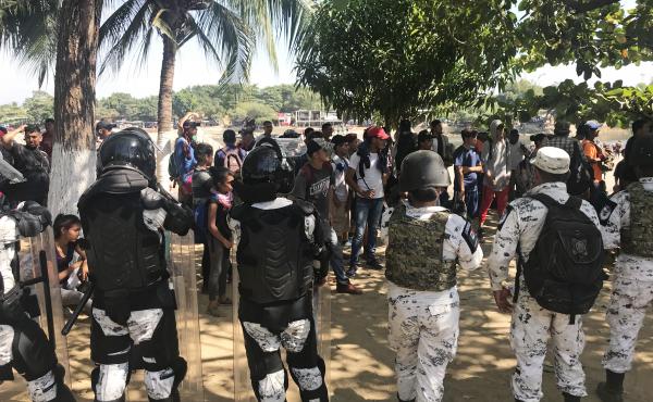 Mexico's National Guard prevents migrants who walked across the river from making their way farther into Mexico. Mexico's National Guard prevents migrants who walked across the river from making their way farther into Mexico.