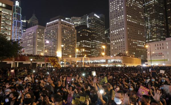 Protesters flash their smartphone lights as they stage a rally at Edinburgh Place in Hong Kong on Friday. This weekend marks five years since the pro-democracy Umbrella Movement formed. Protesters flash their smartphone lights as they stage a rally at Edinburgh Place in Hong Kong on Friday. This weekend marks five years since the pro-democracy Umbrella Movement formed.