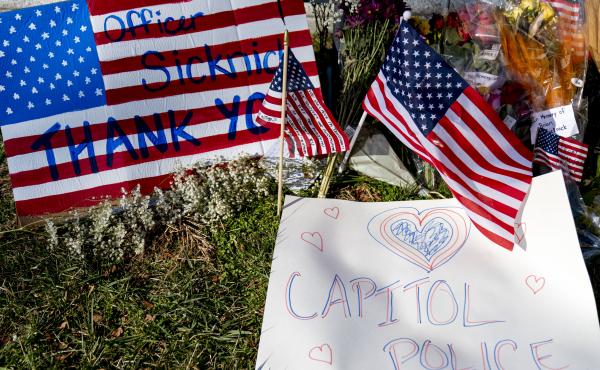 A memorial for U.S. Capitol Police Officer Brian Sicknick, who was killed by rioters in the Jan. 6 attack, is set up near the U.S. Capitol. A memorial for U.S. Capitol Police Officer Brian Sicknick, who was killed by rioters in the Jan. 6 attack, is set up near the U.S. Capitol.