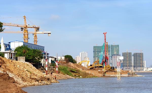 A view of Phnom Penh, the capital of Cambodia, from the riverfront of a temple complex outside the city. A view of Phnom Penh, the capital of Cambodia, from the riverfront of a temple complex outside the city.