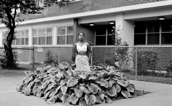 Chanell Stone photographs places like overgrown lots and green spaces at public housing projects, often including herself in the frame. Above, "In search of a certain Eden," 2019, Brooklyn. Chanell Stone photographs places like overgrown lots and green spaces at public housing projects, often including herself in the frame. Above, "In search of a certain Eden," 2019, Brooklyn.