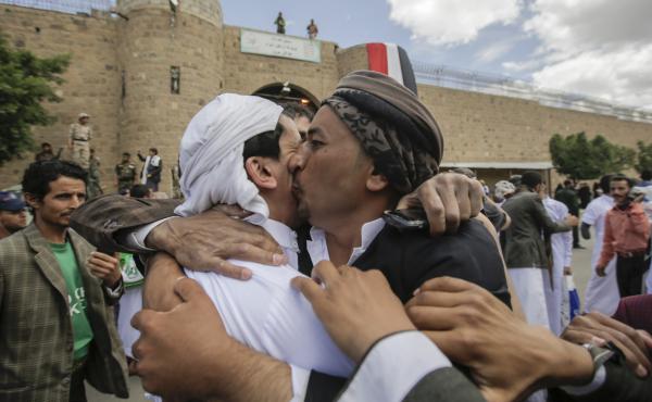 A Yemeni detainee (left) is greeted by a family member after being released by Houthi rebels on Monday. The release was brokered by the International Committee of the Red Cross. A Yemeni detainee (left) is greeted by a family member after being released by Houthi rebels on Monday. The release was brokered by the International Committee of the Red Cross.