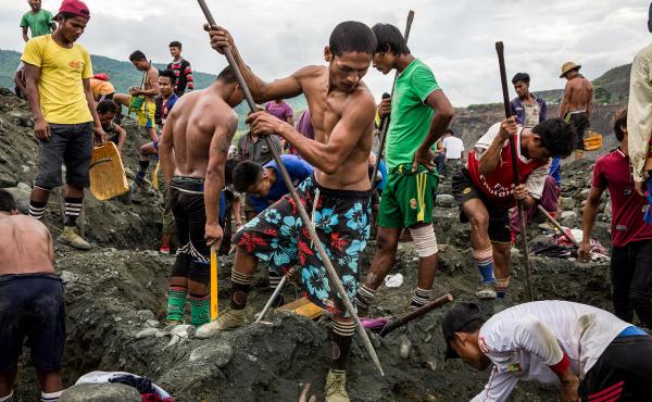 Freelance miners dig for raw jade at a company site in Hpakant, Myanmar, in 2018. Freelance miners dig for raw jade at a company site in Hpakant, Myanmar, in 2018.