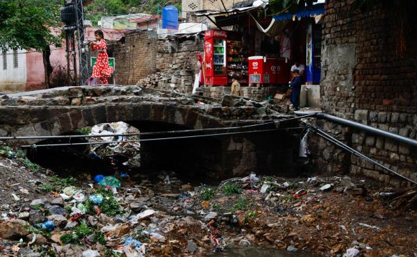 The river that once snaked through the village is now a large trash heap. The river that once snaked through the village is now a large trash heap.