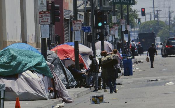 Tents housing homeless line a street down the street from LAPD Central Community Police Station in downtown Los Angeles on May 30, 2019. In this city, homeless encampments are sprouting up in underpasses, along streets and on sidewalks and inside parks. Tents housing homeless line a street down the street from LAPD Central Community Police Station in downtown Los Angeles on May 30, 2019. In this city, homeless encampments are sprouting up in underpasses, along streets and on sidewalks and inside parks.
