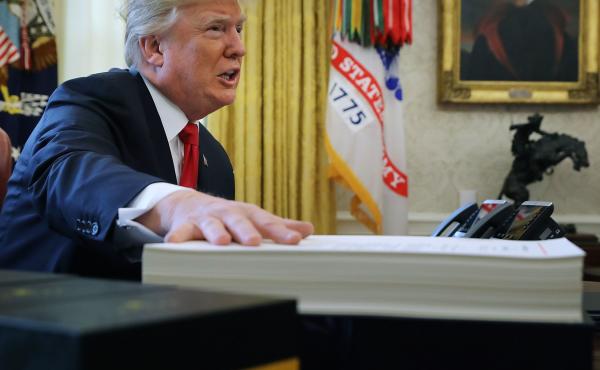 Analysts say real estate tax breaks allowed President Trump to personally avoid high taxes. Above, Trump prepares to sign tax legislation into law in the Oval Office on Dec. 22, 2017. Analysts say real estate tax breaks allowed President Trump to personally avoid high taxes. Above, Trump prepares to sign tax legislation into law in the Oval Office on Dec. 22, 2017.