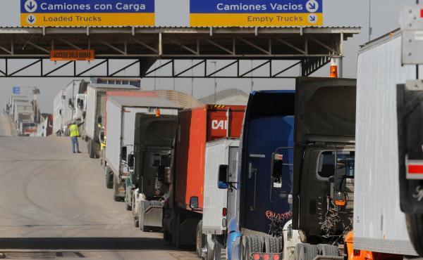 Trucks wait to enter the United States at the border crossing in Tijuana, Mexico, in 2017. More than $1.6 billion in goods flow across the border each day. Trucks wait to enter the United States at the border crossing in Tijuana, Mexico, in 2017. More than $1.6 billion in goods flow across the border each day.