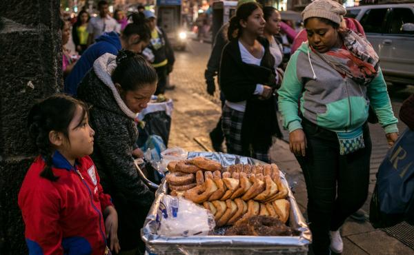 A family sells pastries in Mexico City. As Mexicans' wages have risen, their average daily intake of calories has soared. A family sells pastries in Mexico City. As Mexicans' wages have risen, their average daily intake of calories has soared.