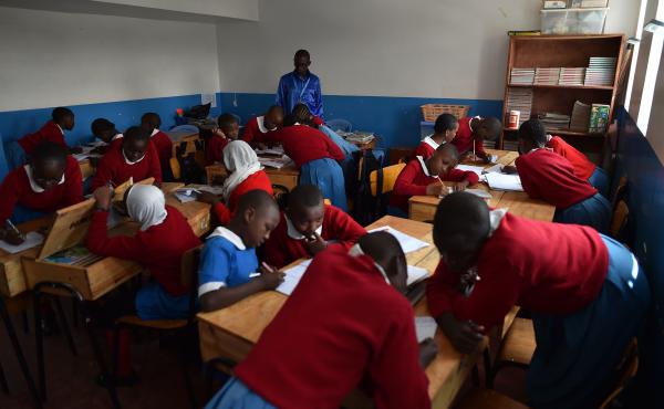 Students work on a classroom exercise at a school in Kibera, a poor neighborhood in Nairobi, Kenya. Students work on a classroom exercise at a school in Kibera, a poor neighborhood in Nairobi, Kenya.