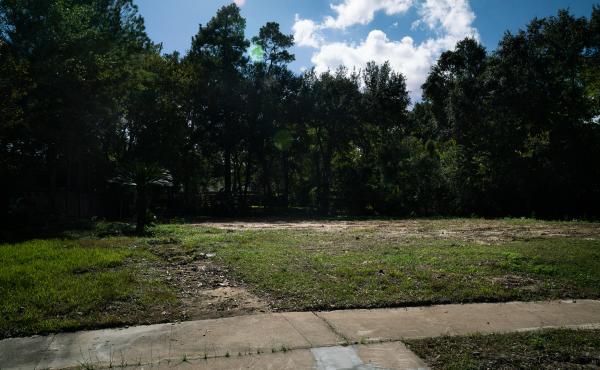 The empty lot of land where John and Heather Papadopoulos' home once stood on Bayou Glen Road. The empty lot of land where John and Heather Papadopoulos' home once stood on Bayou Glen Road.