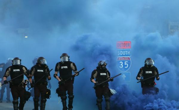Police advance on demonstrators who are protesting the killing of George Floyd on Saturday in Minneapolis. Police advance on demonstrators who are protesting the killing of George Floyd on Saturday in Minneapolis.