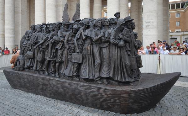 The 20-foot-tall bronze sculpture of a boat loaded with refugees and migrants is the work of Canadian sculptor Timothy Schmalz. Its bread-and-fruit motif encapsulates how food is interlocked with the history of human migration. The 20-foot-tall bronze sculpture of a boat loaded with refugees and migrants is the work of Canadian sculptor Timothy Schmalz. Its bread-and-fruit motif encapsulates how food is interlocked with the history of human migration.