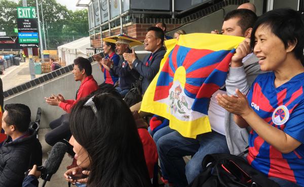 Tibetans cheer on a Tibetan team at a soccer tournament in London. Fans say they were pleased and surprised that the tournament organizers didn't succumb to pressure from potential sponsors and dump the Tibetan team to avoid angering the Chinese governmen Tibetans cheer on a Tibetan team at a soccer tournament in London. Fans say they were pleased and surprised that the tournament organizers didn't succumb to pressure from potential sponsors and dump the Tibetan team to avoid angering the Chinese governmen