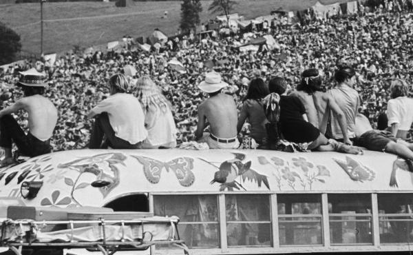 Fans sit atop a painted bus at the Woodstock Music Festival in Bethel, N.Y., in August 1969. Fans sit atop a painted bus at the Woodstock Music Festival in Bethel, N.Y., in August 1969.