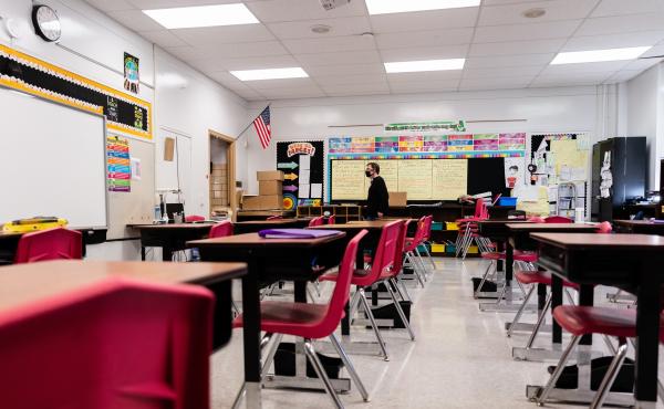 A teacher walks through an empty classroom at Hazelwood Elementary School in Louisville, Ky., on Jan. 11. A teacher walks through an empty classroom at Hazelwood Elementary School in Louisville, Ky., on Jan. 11.