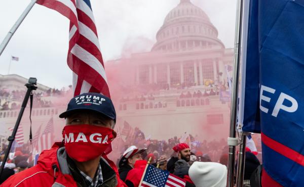 A protester unleashes a smoke grenade in front of the U.S. Capitol building on Jan. 6, 2021. A protester unleashes a smoke grenade in front of the U.S. Capitol building on Jan. 6, 2021.
