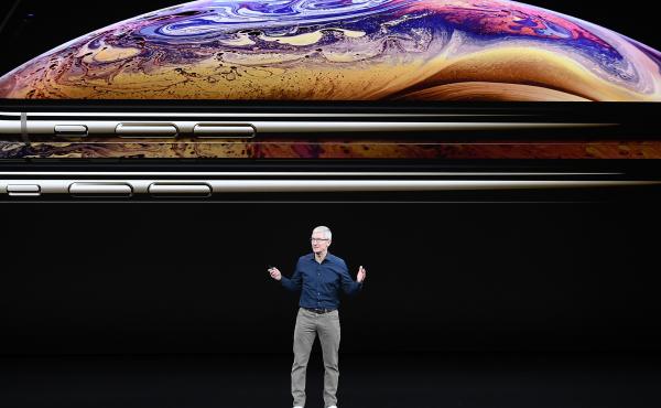 Tim Cook, chief executive officer of Apple Inc., speaks during an event in 2018. Apple is one of 310 companies calling on the Biden administration to slash carbon emissions. Tim Cook, chief executive officer of Apple Inc., speaks during an event in 2018. Apple is one of 310 companies calling on the Biden administration to slash carbon emissions.