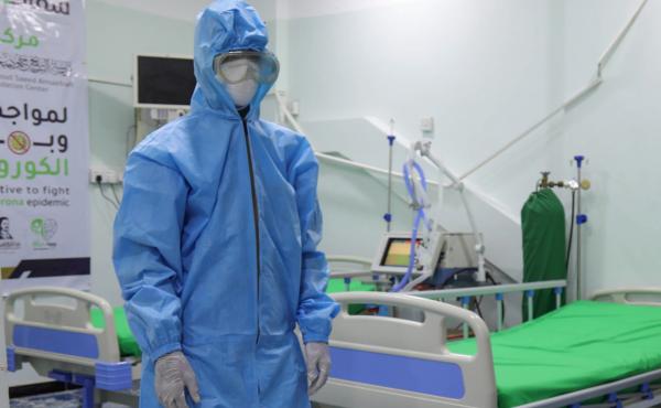 A health worker in personal protective equipment stands in a COVID-19 intensive care unit in Taiz, Yemen. A health worker in personal protective equipment stands in a COVID-19 intensive care unit in Taiz, Yemen.