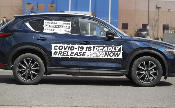 A sign on a vehicle during a protest outside an ICE detention center in Colorado. Immigration lawyers are calling for the release of detainees as the coronavirus spreads at ICE facilities around the country. A sign on a vehicle during a protest outside an ICE detention center in Colorado. Immigration lawyers are calling for the release of detainees as the coronavirus spreads at ICE facilities around the country.