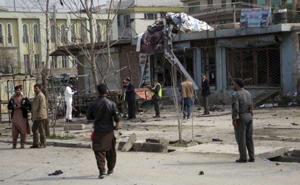 Security personnel inspec the site of a suicide attack in Kabul, on Friday. Security personnel inspec the site of a suicide attack in Kabul, on Friday.