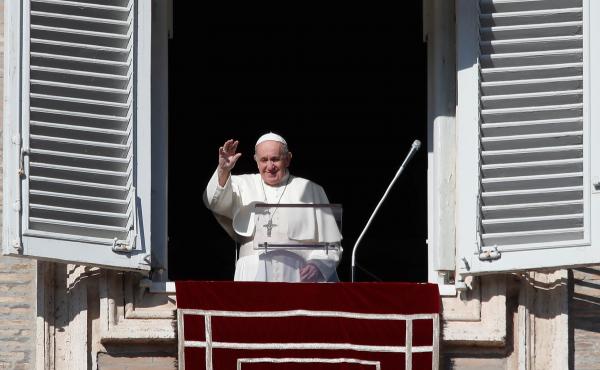 Pope Francis waves as he arrives for the Angelus noon prayer from the window of his studio overlooking St. Peter's Square, at the Vatican, Sunday. Pope Francis waves as he arrives for the Angelus noon prayer from the window of his studio overlooking St. Peter's Square, at the Vatican, Sunday.