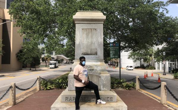 Protest organizer DAntjuan Miller stands by the granite pedestal that remains of a monument to Confederate Navy Adm. Raphael Semmes in Mobile, Ala. "It's like a weight that's lifted off now that it's gone," he says. Protest organizer DAntjuan Miller stands by the granite pedestal that remains of a monument to Confederate Navy Adm. Raphael Semmes in Mobile, Ala. "It's like a weight that's lifted off now that it's gone," he says.