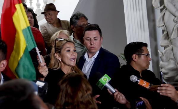 Senate second Vice President Jeanine Añez as she arrives to Congress in La Paz on Monday. She says she will lead the Senate after its president resigned, which could make her next in line for the presidency. Senate second Vice President Jeanine Añez as she arrives to Congress in La Paz on Monday. She says she will lead the Senate after its president resigned, which could make her next in line for the presidency.