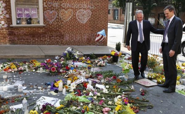 Sen. Tim Kaine, left, and then-Charlottesville mayor Michael Signer visit a temporary memorial Wednesday, Aug. 16, 2017, where Heather Heyer was killed when a car rammed into a crowd of people protesting a white nationalist rally Charlottesville, Va. Sen. Tim Kaine, left, and then-Charlottesville mayor Michael Signer visit a temporary memorial Wednesday, Aug. 16, 2017, where Heather Heyer was killed when a car rammed into a crowd of people protesting a white nationalist rally Charlottesville, Va.