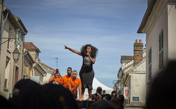 Assa Traoré addresses a crowd during a demonstration in Persan, France, to commemorate the fourth anniversary of her brother Adama Traoré's death. "The fight for justice for Adama belongs to all of France," she says. Assa Traoré addresses a crowd during a demonstration in Persan, France, to commemorate the fourth anniversary of her brother Adama Traoré's death. "The fight for justice for Adama belongs to all of France," she says.