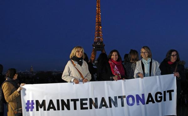 French Culture Minister Françoise Nyssen (second right), Paris Mayor Anne Hidalgo (center) and women's rights activists hold a banner reading "Maintenant on agit" ("Now we act"), on the eve of International Women's Day on March 7. They aim to raise funds French Culture Minister Françoise Nyssen (second right), Paris Mayor Anne Hidalgo (center) and women's rights activists hold a banner reading "Maintenant on agit" ("Now we act"), on the eve of International Women's Day on March 7. They aim to raise funds