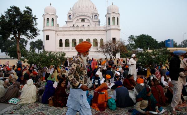 Sikh worshippers gather outside their holiest site, the Gurdwara Darbar Sahib Kartarpur. It is believed to be the place where the founder of Sikhism, Guru Nanak, died in the 16th century. In a rare goodwill gesture this week, India and Pakistan broke grou Sikh worshippers gather outside their holiest site, the Gurdwara Darbar Sahib Kartarpur. It is believed to be the place where the founder of Sikhism, Guru Nanak, died in the 16th century. In a rare goodwill gesture this week, India and Pakistan broke grou