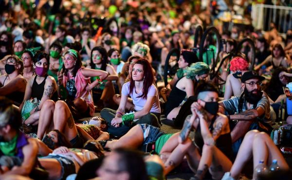 Demonstrators wait with green headscarves — the symbol of abortion rights activists — outside the Argentine Congress in Buenos Aires, where lawmakers endorsed a bill to legalize abortion Demonstrators wait with green headscarves — the symbol of abortion rights activists — outside the Argentine Congress in Buenos Aires, where lawmakers endorsed a bill to legalize abortion