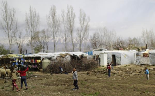 Syrian refugee children play at an informal refugee camp in Lebanon's Bekaa valley. Syrian refugee children play at an informal refugee camp in Lebanon's Bekaa valley.