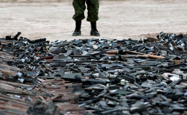 A new government report details the problems agencies face in fighting weapons trafficking. Here, thousands of guns lie on the ground before being destroyed in Ciudad Juarez, Mexico, in 2012. A new government report details the problems agencies face in fighting weapons trafficking. Here, thousands of guns lie on the ground before being destroyed in Ciudad Juarez, Mexico, in 2012.