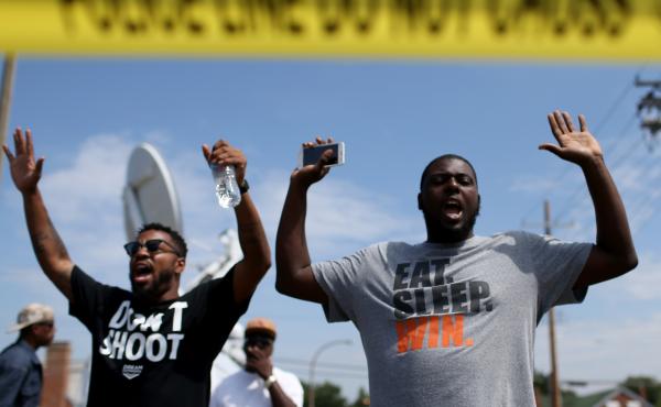 The shooting of Michael Brown in Ferguson, Mo., also led to a series of protests. Many of them, like this protest on Aug. 19, featured people raising their arms and chanting, "Hands up, don't shoot." But interactions between police and protesters were mor The shooting of Michael Brown in Ferguson, Mo., also led to a series of protests. Many of them, like this protest on Aug. 19, featured people raising their arms and chanting, "Hands up, don't shoot." But interactions between police and protesters were mor