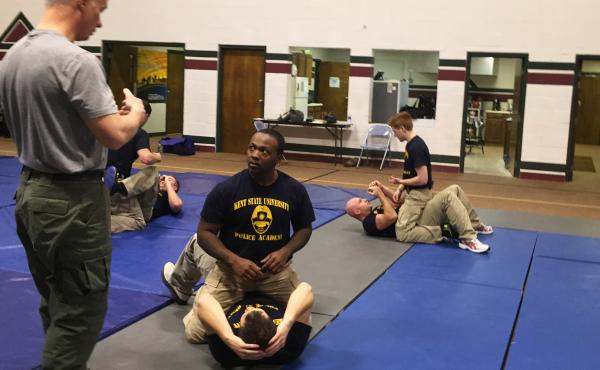The Akron Police Department training class works out at Kent State Basic Police Officer Training Academy. Donald Clayton is the only African-American in the class of 20. The Akron Police Department training class works out at Kent State Basic Police Officer Training Academy. Donald Clayton is the only African-American in the class of 20.