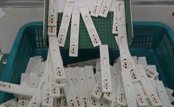 Antibody test cartridges used in diagnosing the coronavirus move along on a production line at Boditech Med in Chuncheon, South Korea. By Friday, authorities had identified 163 patients who tested positive again after a full recovery. Antibody test cartridges used in diagnosing the coronavirus move along on a production line at Boditech Med in Chuncheon, South Korea. By Friday, authorities had identified 163 patients who tested positive again after a full recovery.