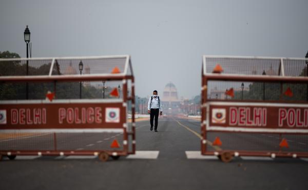 A man walks a deserted road in New Delhi. Indian Prime Minister Narendra Modi asked Tuesday that residents across the country stay where they are in order to help stem the spread of the coronavirus and the deadly disease it can cause, COVID-19. A man walks a deserted road in New Delhi. Indian Prime Minister Narendra Modi asked Tuesday that residents across the country stay where they are in order to help stem the spread of the coronavirus and the deadly disease it can cause, COVID-19.