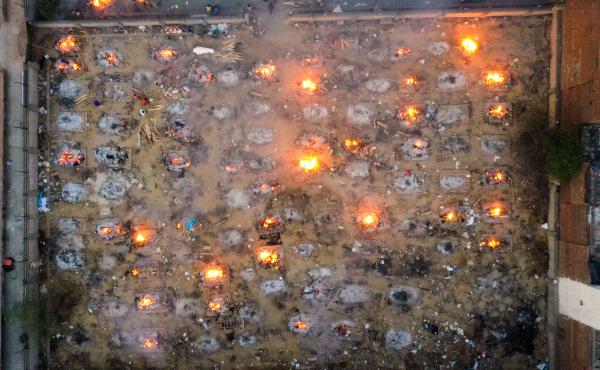 Victims of COVID-19 are cremated in funeral pyres this week in New Delhi. Scientists says the real death toll and number of infections are likely much higher than what the Indian government is reporting. Victims of COVID-19 are cremated in funeral pyres this week in New Delhi. Scientists says the real death toll and number of infections are likely much higher than what the Indian government is reporting.