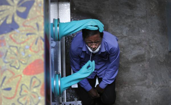 A health worker takes a nasal swab for COVID-19 at a hospital in New Delhi. India has overtaken Russia to become the third-worst coronavirus affected nation. A health worker takes a nasal swab for COVID-19 at a hospital in New Delhi. India has overtaken Russia to become the third-worst coronavirus affected nation.