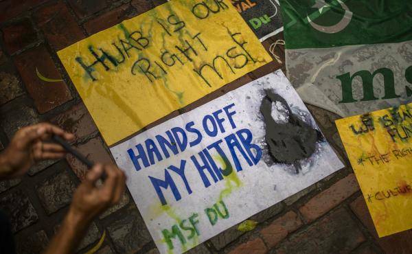 A student takes photographs of placards during a protest against banning Muslim girls from wearing the hijab in educational institutions in the southern Indian state of Karnataka, in New Delhi on Feb. 8, 2022. A student takes photographs of placards during a protest against banning Muslim girls from wearing the hijab in educational institutions in the southern Indian state of Karnataka, in New Delhi on Feb. 8, 2022.