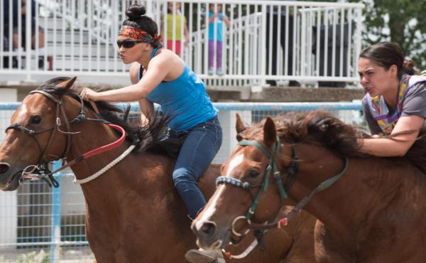 Raedeyn Teton, left, and Jessica Broncho, race side-by-side in an Indian Relay on the Fort Hall Indian Reservation in Idaho. Raedeyn Teton, left, and Jessica Broncho, race side-by-side in an Indian Relay on the Fort Hall Indian Reservation in Idaho.